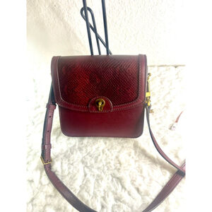 Fossil Ainsley Small Flap Crossbody bag in a burgundy croc print